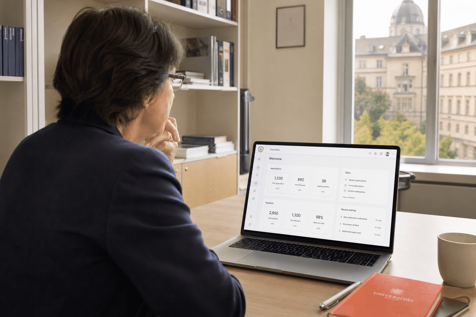 Institution staff reviewing student card administration on a laptop