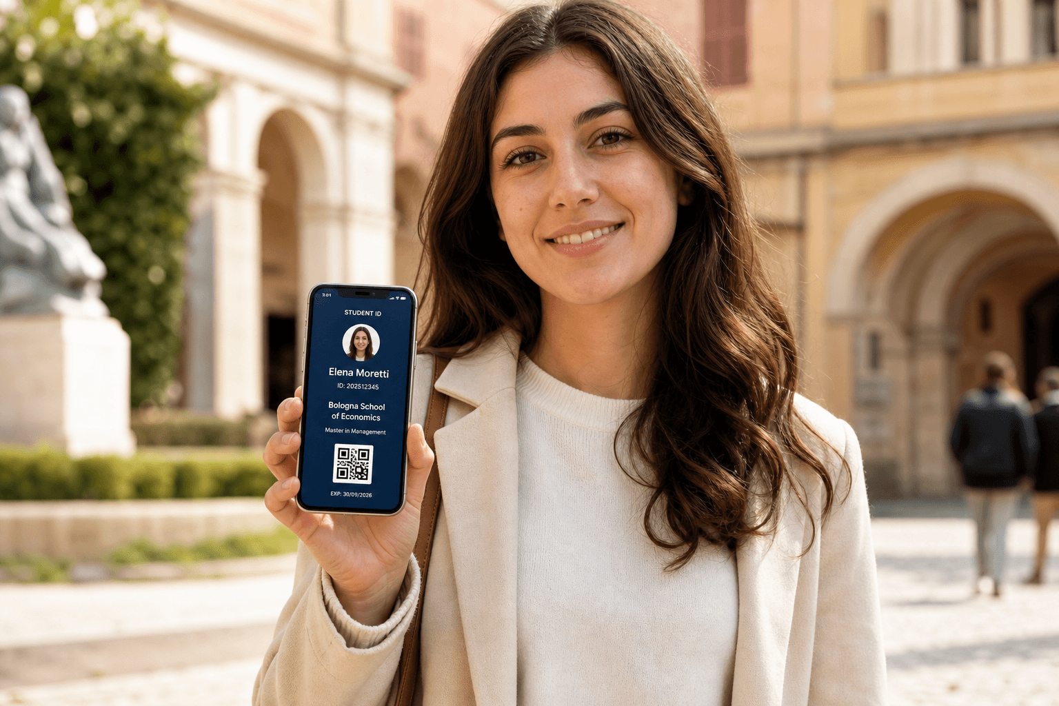 Student on a European campus holding a phone with a digital student card